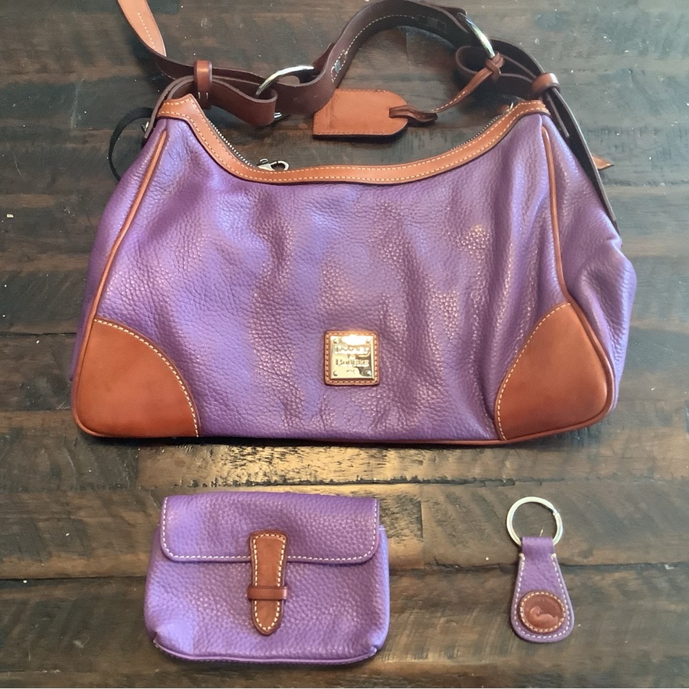 Dooney and Bourke shoulder bag.  Also included coin purse and key chain.